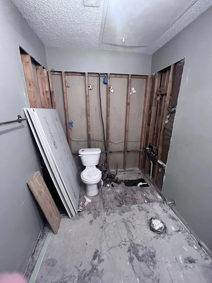 Before: Down to the studs, rebuilt with subway tile and a built-in niche
