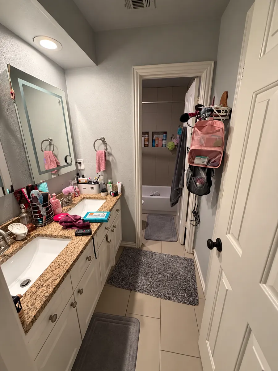 Before: Guest bathroom remodel featuring a new marble-look porcelain tile shower